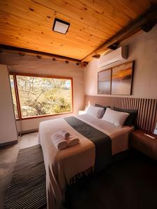 Katil atau katil-katil dalam bilik di Cabanas do Ouro - O seu refúgio dos sonhos em Pirenópolis
