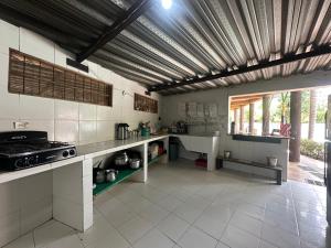 a kitchen with a stove and a counter top at Hostal Luz de Luna in Palomino