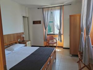 Postel nebo postele na pokoji v ubytování Hotel Montallegro