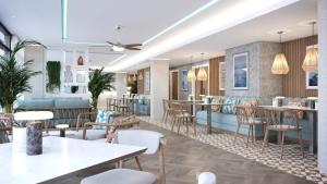 a rendering of a restaurant with tables and chairs at Hotel Indigo Torquay by IHG in Torquay +42 photos