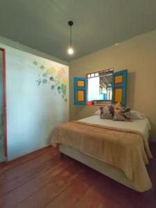 a bedroom with a bed and a window in it at Bosque De Niebla Casa Rural in La Florida