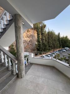 a balcony with a view of a parking lot at Hotel Oaz in Fushë-Krujë