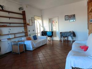 a living room with two couches and a table at Casa Panorama Viterbo Senza ZTL e Parcheggio Gratuito in Viterbo