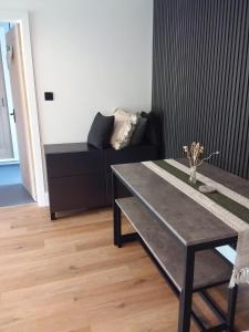 a living room with a table and a couch at Kingfisher Luxury Tent, Howdales in Louth +15 photos