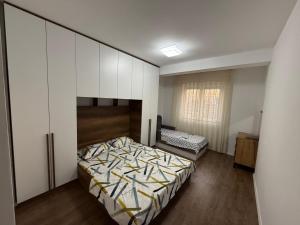 Postel nebo postele na pokoji v ubytování Elite Central Apartment