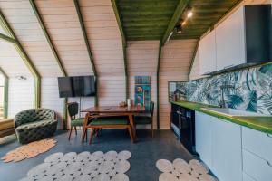 a kitchen and dining room with a table and a sink at tetova in Sapanca