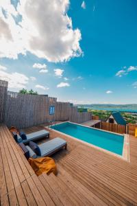 a backyard with a swimming pool and a wooden deck at tetova in Sapanca
