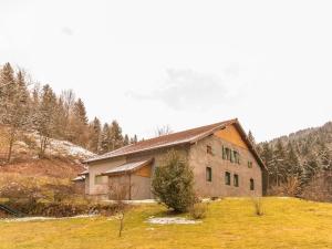 a house in the middle of a field with trees at Grande maison au cœur des Vosges, escapades et nature - FR-1-583-466 in Belfahy