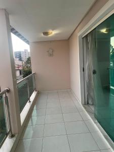 a room with a hallway with a glass door at Casa na Suíça baina in Vitória da Conquista