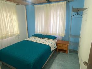 Ένα ή περισσότερα κρεβάτια σε δωμάτιο στο Casa finca San Martín