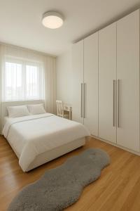 Giường trong phòng chung tại Urban Nest Prishtina