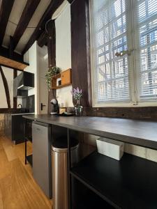 Η κουζίνα ή μικρή κουζίνα στο Appartement cosy et charme - 347 +11 φωτογραφίες