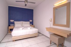 Een bed of bedden in een kamer bij Pal Beach