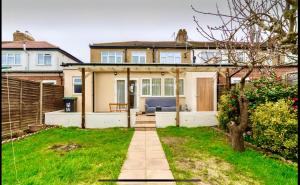 a house with a pathway leading to the front of it at Sleep-2 Studio-Free Parking Pet-Tottenham Stadium in London