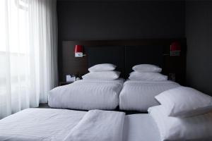 Best Western Plus Plaza Hotel Graz客房内的一张或多张床位