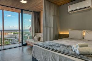 Ένα ή περισσότερα κρεβάτια σε δωμάτιο στο Edifício New Time Apto 1215-Mandi Hospitalidade +36 φωτογραφίες