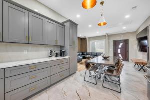 a kitchen with a table and a dining room at Coco in Farmington Hills