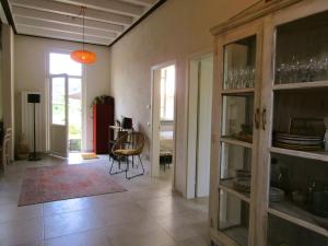 a living room with a table and a dining room at Il Tulipano in Camaiore