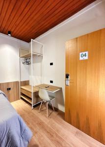 Giường trong phòng chung tại Ivaí Hotel