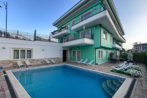 a house with a swimming pool in front of it at Hotel San Berardo in Pescina