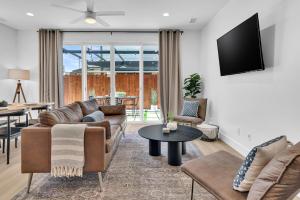 a living room with a couch and a table at The Park Street Hideaway in Downtown Paso in Paso Robles