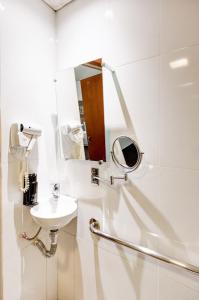 Um banheiro em Allia Gran Pampulha Suites