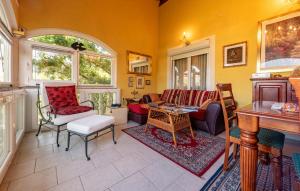 a living room with a couch and chairs at Vista Mare in Vinjerac