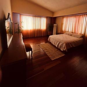 Ένα ή περισσότερα κρεβάτια σε δωμάτιο στο Casa Carmesí +2 φωτογραφίες