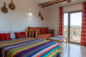 Ένα ή περισσότερα κρεβάτια σε δωμάτιο στο Kaouki Zen Lodge