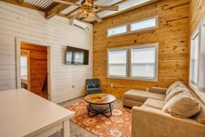 a living room with a couch and a table at Lagoon Ranch RV Resort in Onalaska