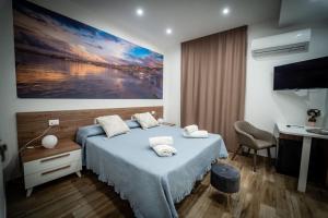 Ένα ή περισσότερα κρεβάτια σε δωμάτιο στο B&B SAN LORENZO +60 φωτογραφίες