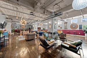 a living room with a lot of chairs and tables at Haven 326 2bd Loft Sleeps 10 Free Parking in Dallas