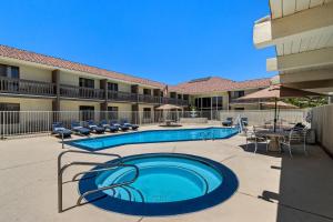 a swimming pool in front of a hotel at Red Roof Inn Ridgecrest in Ridgecrest
