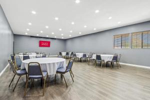 a conference room with tables and chairs in it at Red Roof Inn Ridgecrest in Ridgecrest +48 photos