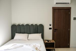 Postel nebo postele na pokoji v ubytování OLI Hotel