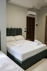 Postel nebo postele na pokoji v ubytování OLI Hotel