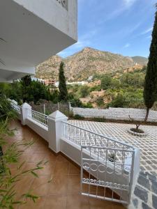 a balcony with a view of a mountain at Casa Hugo in Chefchaouen