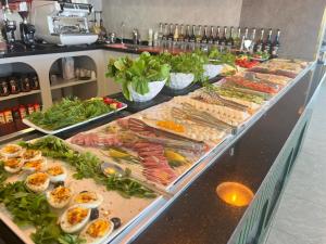 a buffet line with many different types of food at Blue Lake Otel in Beysehir