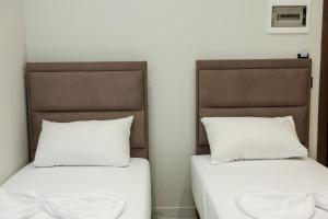 Postel nebo postele na pokoji v ubytování OLI Hotel