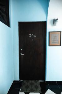 a black door with the number fifty four on it at Old San Juan The Core By Otium in San Juan