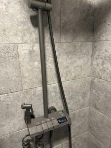 a stand up shower in a bathroom with a tile wall at Perfect place 4 Djenovici in Đenovići