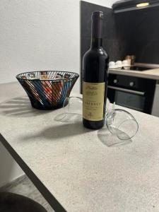 a bottle of wine sitting on a counter in a kitchen at Perfect place 4 Djenovici in Đenovići