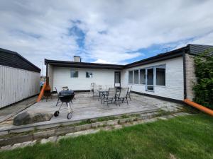 a backyard with a bbq and a grill at Casa blanca in Kosta
