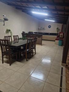 a dining room with a table and chairs at Pousada Essência da Canastra in Vargem Bonita +28 photos