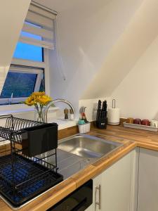 a kitchen with a sink and a window at Modern Stay - Walk to Everything 6 in Ipswich +16 photos