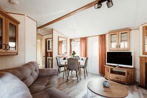 a living room with a couch and a table at Villa Hexengericht in Thale