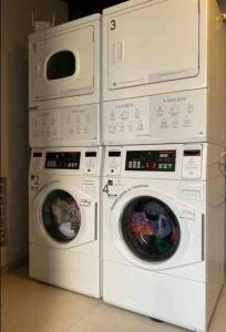 four washing machines stacked on top of each other at Hermoso Apartaestudio LOFT in Bogotá