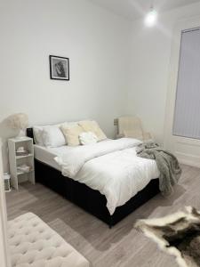 a bedroom with a large bed in a room at The Botanica, Stylish Edgbaston Escape with Garden Charm in Birmingham