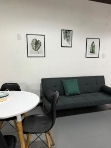 a living room with a couch and a table at EzeApart in Ezeiza