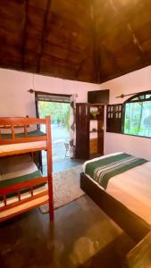 Ένα ή περισσότερα κρεβάτια σε δωμάτιο στο Ampla suíte em conexão com a natureza